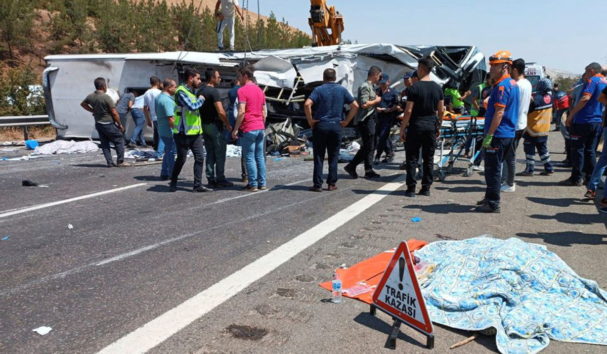 Rescue and emergency responders work at the scene after a bus crash